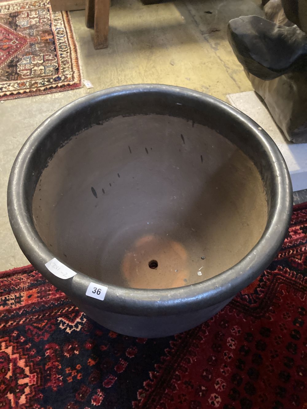 A large glazed gun metal garden planter, diameter 60cm
